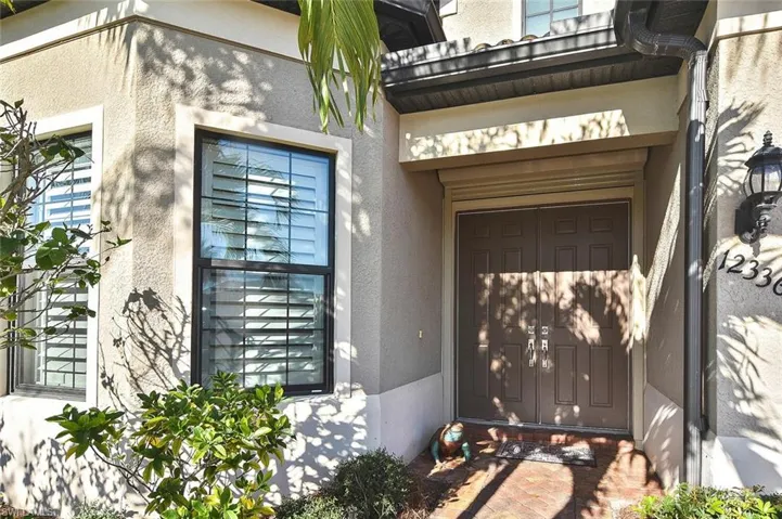 Covered Double Door entry.  A Storm Screen is installed for added protection from storms