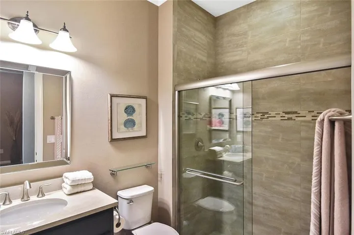 One of the Guest Baths with tiled walk-in shower