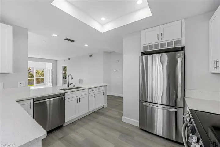 New crisp white Kitchen with stainless appliances
