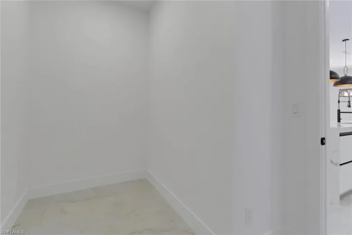 Walk in Pantry with room for 2nd Fridge, shelving, or custom bulter pantry.
