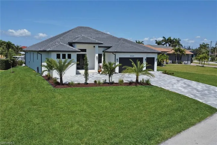 Single story home featuring a tile roof
