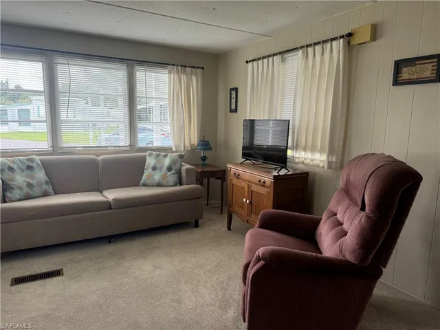 Living room featuring carpet floors