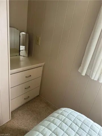 Bedroom with light carpet