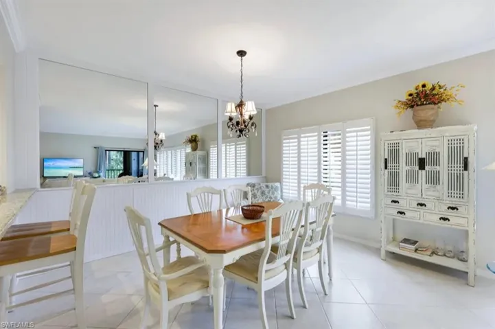 Dining space with a chandelier and light tile patterned floors
