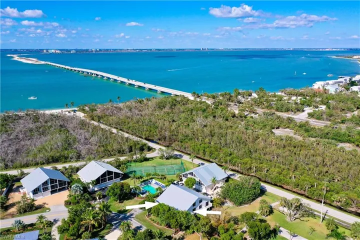 Aerial overview of property's location featuring a large body of water and causeway.