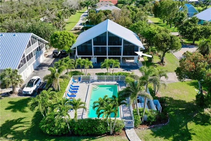 View from above of property featuring a pool area