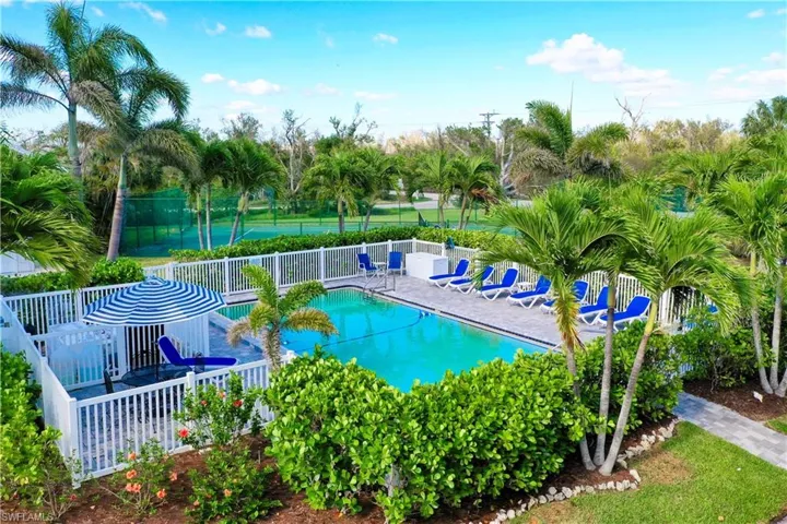 Community pool with a patio