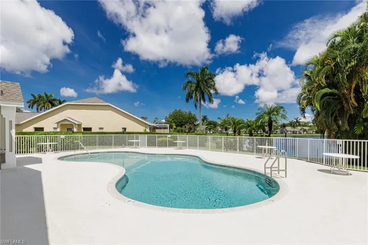 Community pool with a patio area