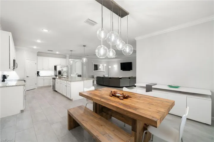 Dining area with ornamental molding
