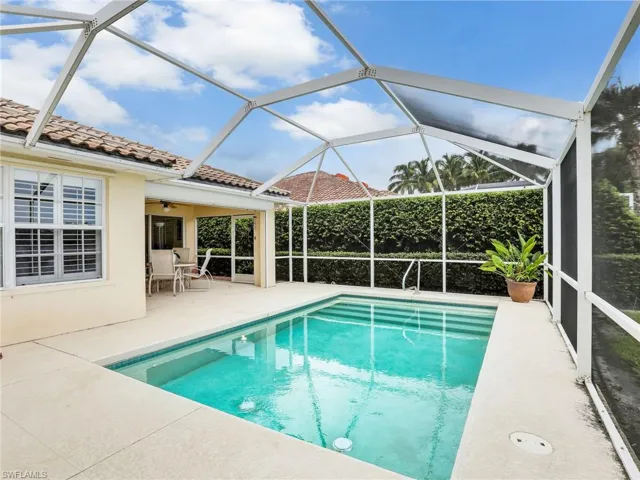 View of pool with a patio, a lanai, and ceiling fan