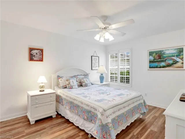 Bedroom featuring ceiling fan and light hardwood / wood-style flooring