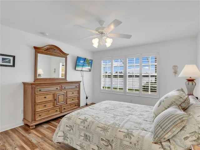 Bedroom featuring ceiling fan and light hardwood / wood-style floors