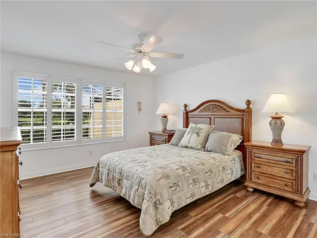 Bedroom featuring light hardwood / wood-style floors and ceiling fan