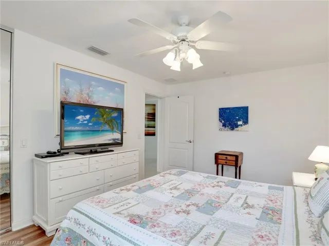 Bedroom featuring ceiling fan and light wood-type flooring