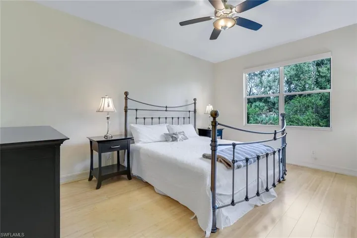 Bedroom featuring light wood-type flooring and ceiling fan