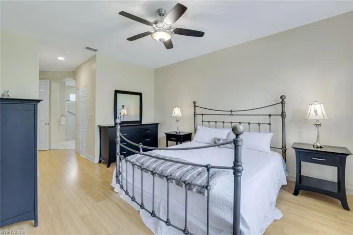 Bedroom with light hardwood / wood-style flooring and ceiling fan