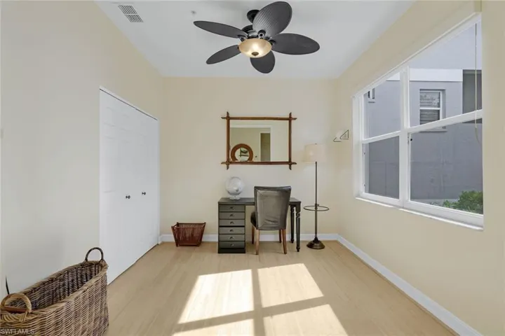 Office area featuring ceiling fan and light wood-type flooring