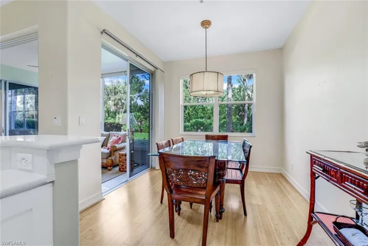 Dining area with light wood-type flooring and plenty of natural light