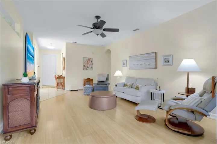 Living room featuring light hardwood / wood-style floors and ceiling fan
