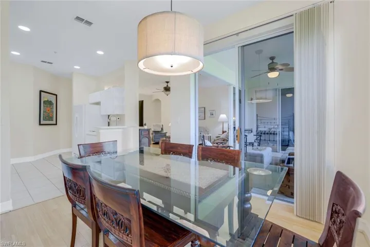 Dining area featuring ceiling fan, light hardwood / wood-style flooring, and sink