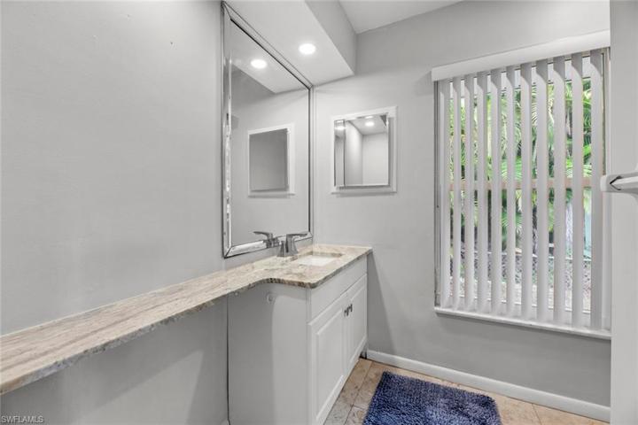 Single vanity sink with walk in shower.