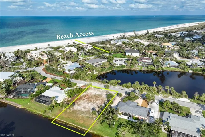 Aerial view of residential area with extended coastline and property parcel outlined