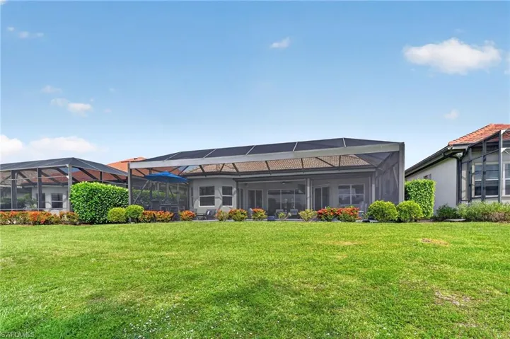 Expansive green space beyond lanai cage