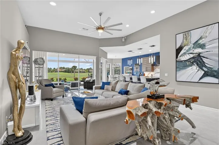 Living area with volume ceilings, recessed lighting, and stunning views