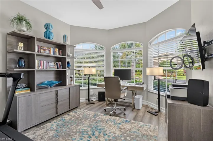 This 3rd bedroom is being used as an office with enough area for workout equipment, storage, functional office space and room to spare