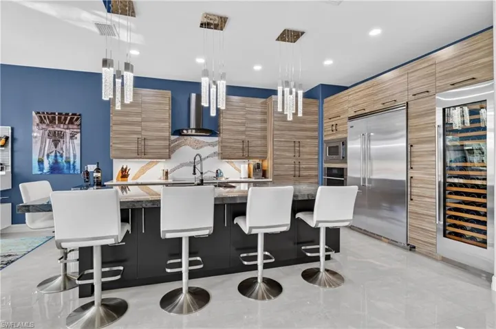 Modern kitchen featuring wood-finish cabinetry, Viking appliances, and a Sub Zero built-in wine refrigerator