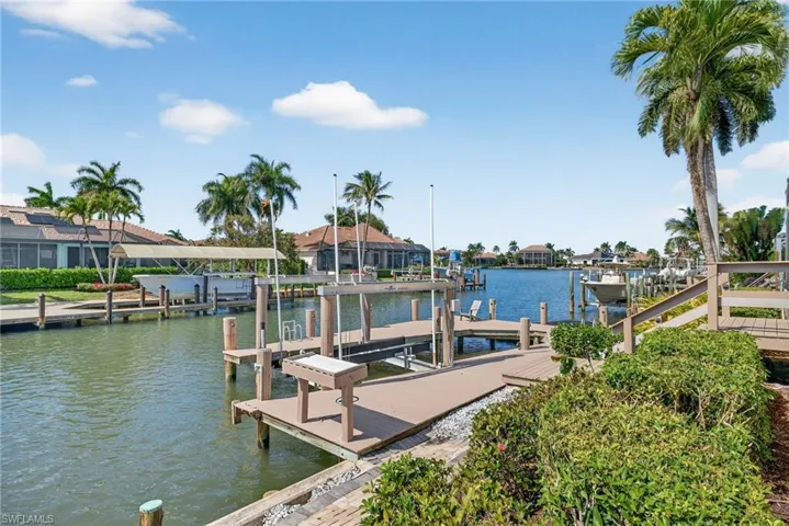 Dock with boat lift and a water view