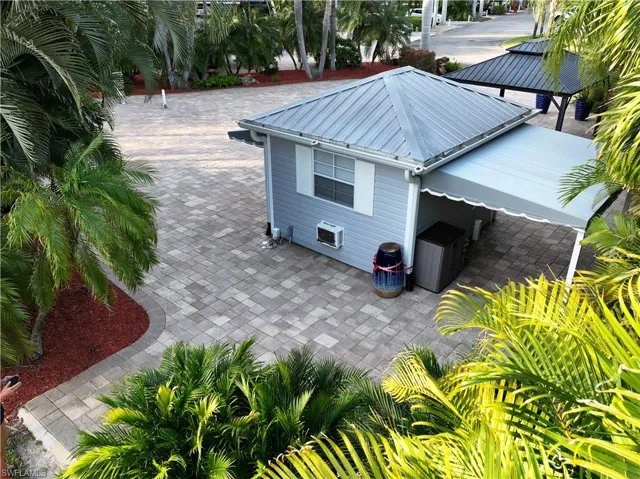 View of side of home with a patio