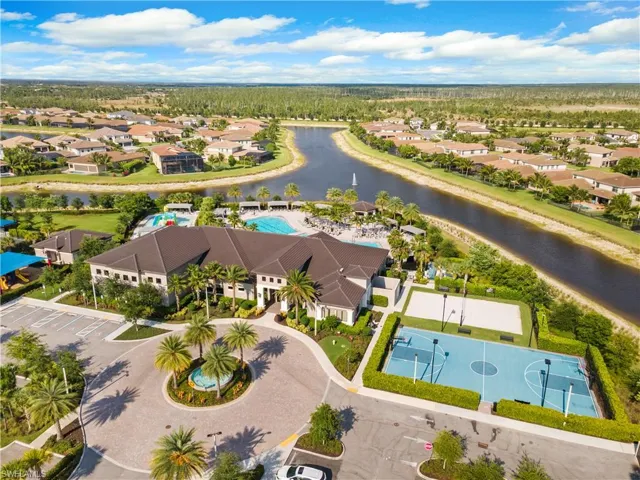 Aerial view of a nearby body of water and a pool area