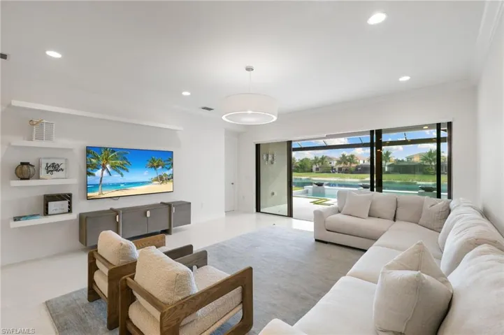 Dining room featuring crown molding and recessed lighting
