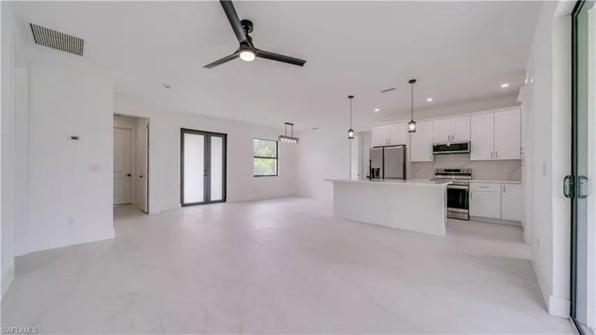 Double front door entry! Gorgeous tile flooring throughout! High 9'4" ceilings, & 8' tall doors!