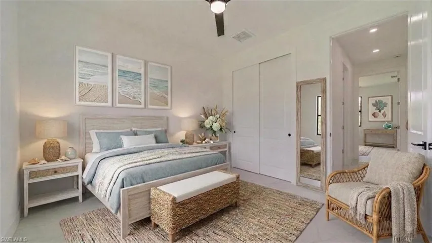 Front guest Bedroom, Hallway behind chair leads to guest/second bathroom & another guest bedroom. (Virtually staged)