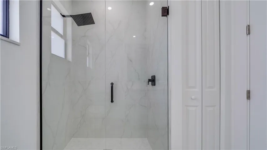 Guest/second bathroom all tile walk-in rain shower.
