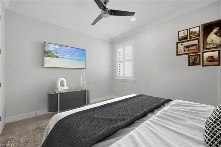 Gray wall-to-wall carpeting complements light gray wall finishes