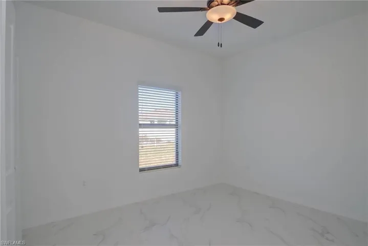 Unfurnished room with ceiling fan