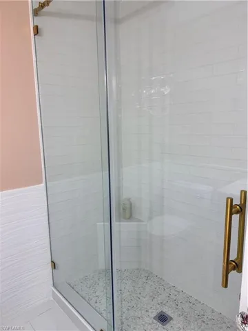 Guest Full bath featuring a stall shower