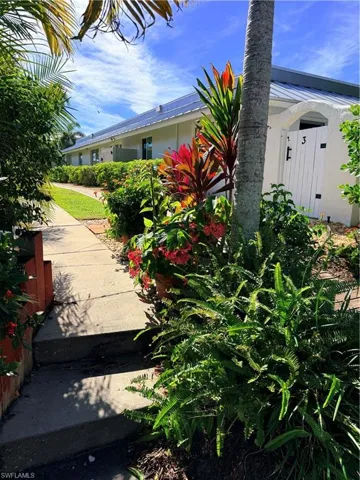 Entry filled with flowers and fauna leading to the dock