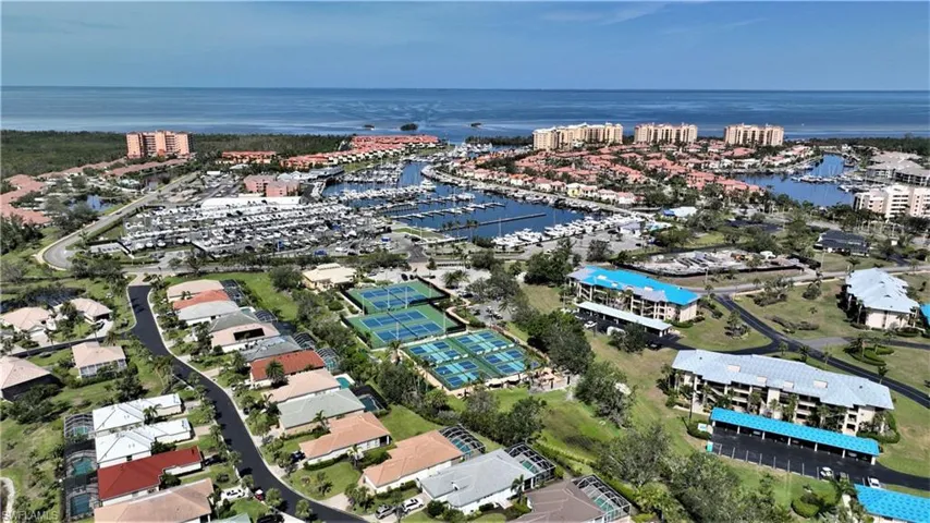 Birds eye view of property with a water view