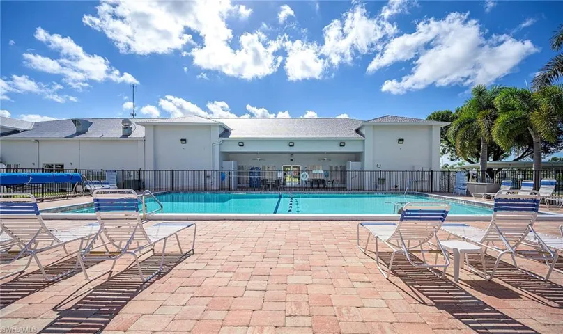 Pool featuring fence and a patio