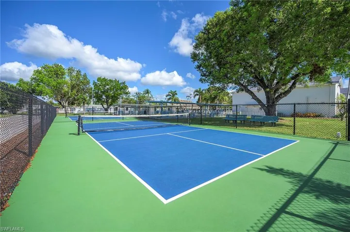 View of tennis court with fence