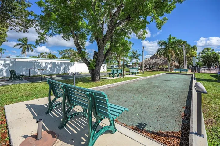 Surrounding community featuring a lawn and fence
