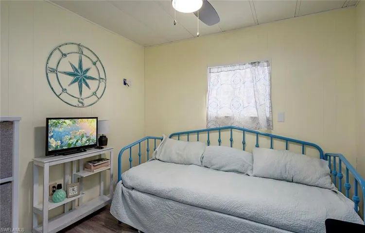 Bedroom with wood finished floors