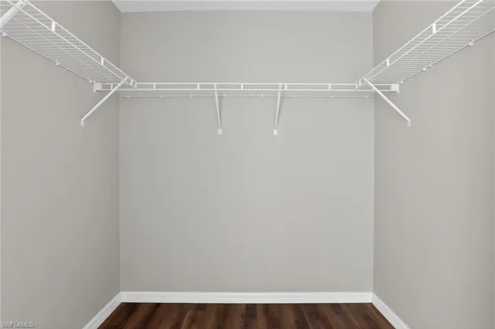 Interior closet featuring wire shelving and a hanging rod system