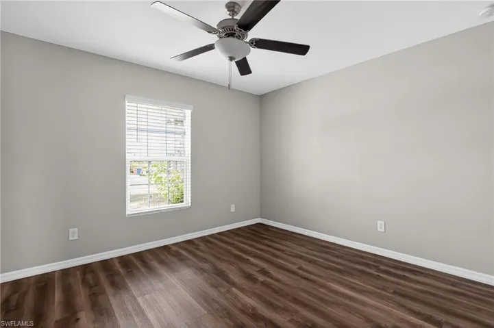Neutral gray wall paint and wood-finish flooring
