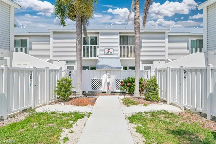 Back of house featuring a balcony