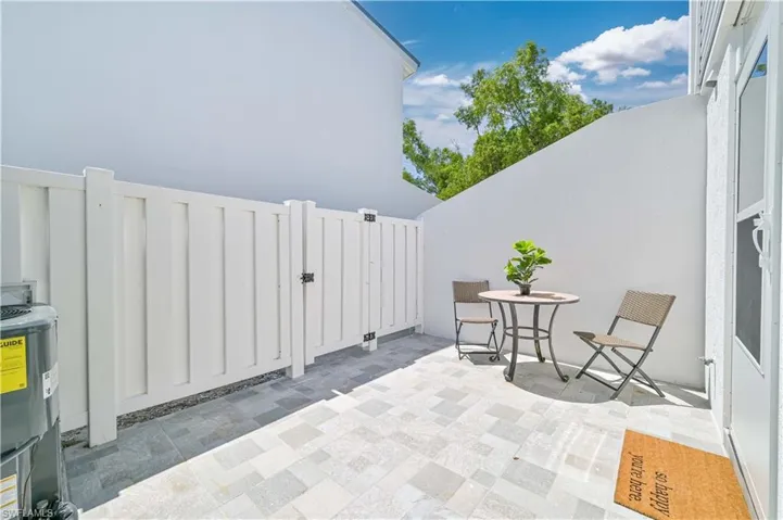 View of terrace featuring electric water heater